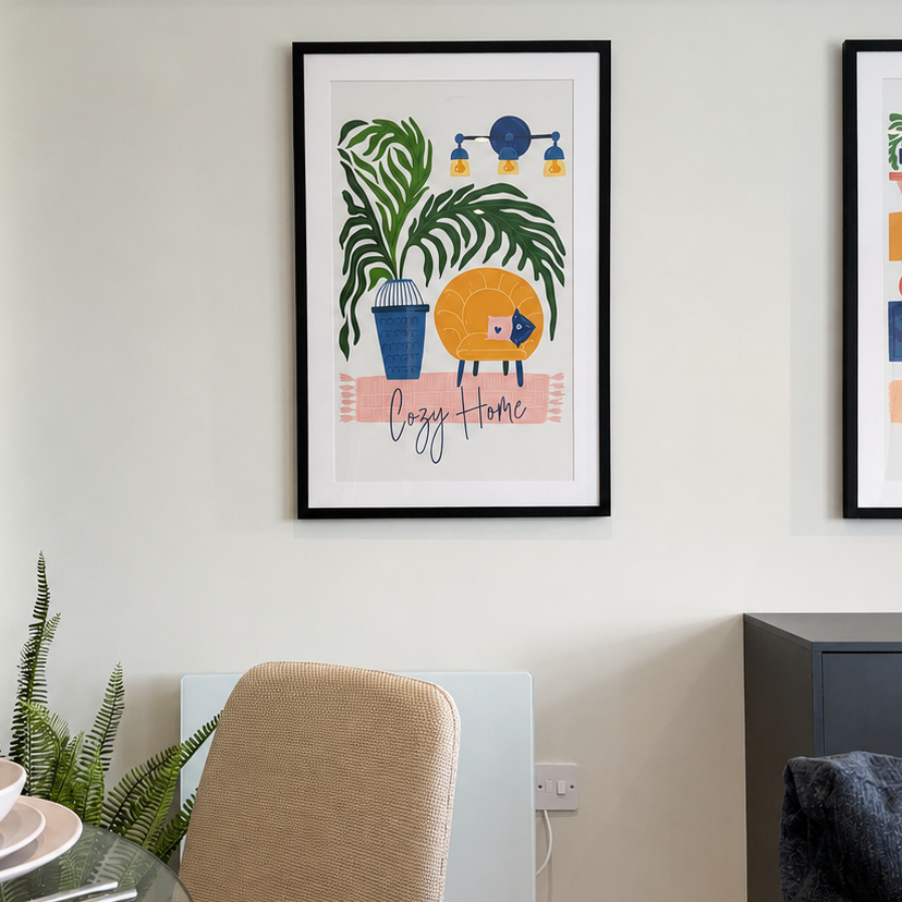 Nooklife Accessory Collection styled interior with framed botanical artwork a leafy plant layered tableware and a textured dining chair beside a dark cabinet and sofa